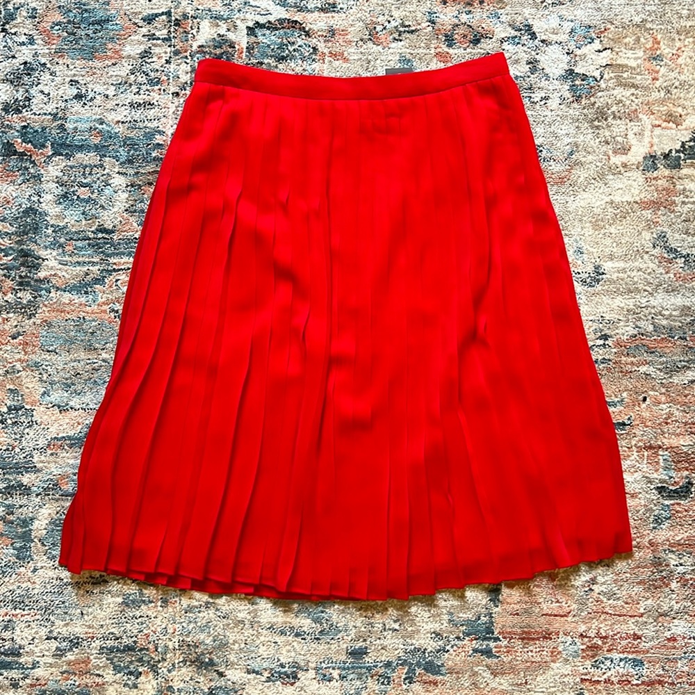 Red pleated midi skirt